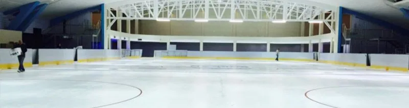 The ice surface and steel roof trusses inside the Durban Ice Rink